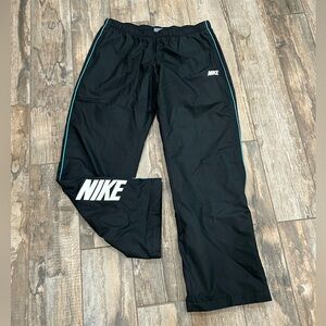 Women Sz L Nike Black Track Pants Teal Trim White Logo. 2 Front pockets Pull On